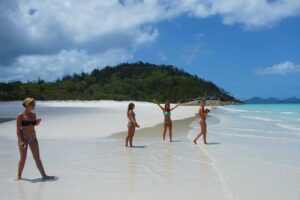 Girls walking on Whitehaven Beach